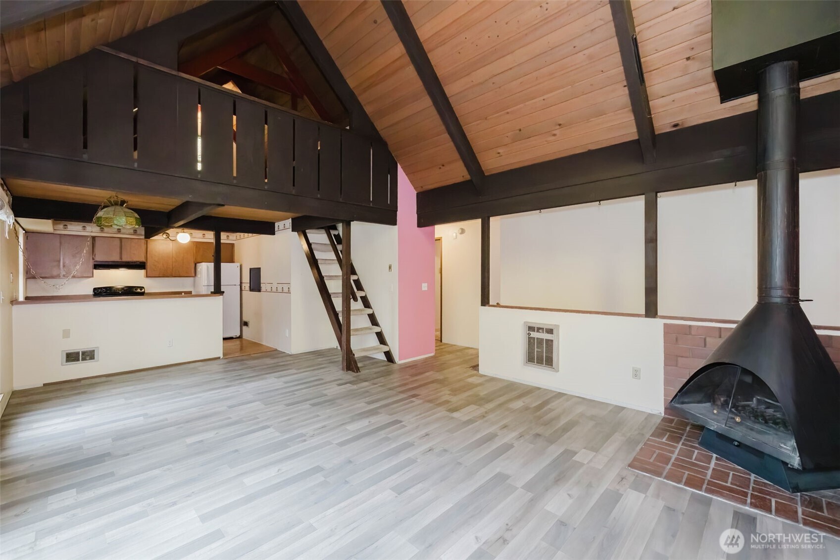 4311 67th Avenue West, Unit B Tacoma, WA 98466 - Photo 13 of 39 a kitchen with granite countertop a stove and a wooden floors