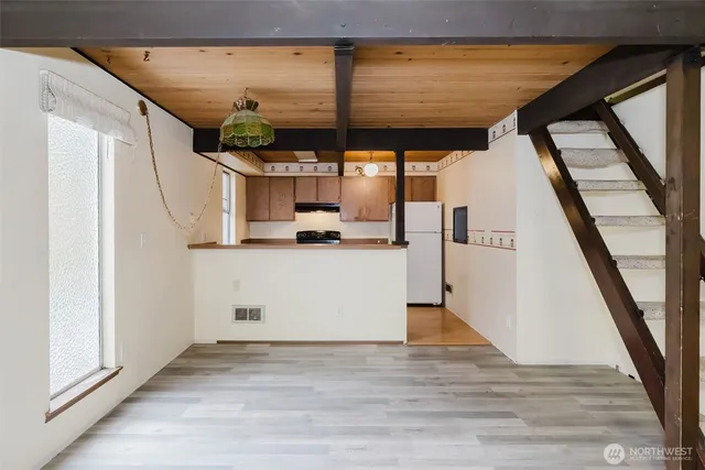 a kitchen with a stove and a refrigerator