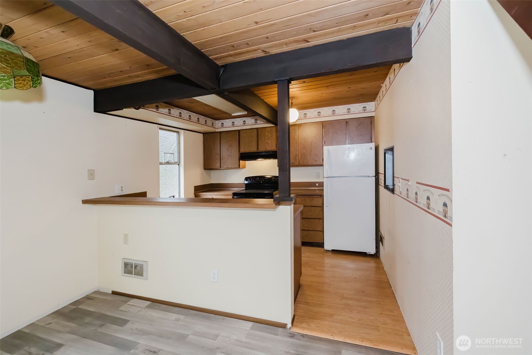 4311 67th Avenue West, Unit B Tacoma, WA 98466 - Photo 15 of 39 a kitchen with stainless steel appliances a refrigerator and a stove