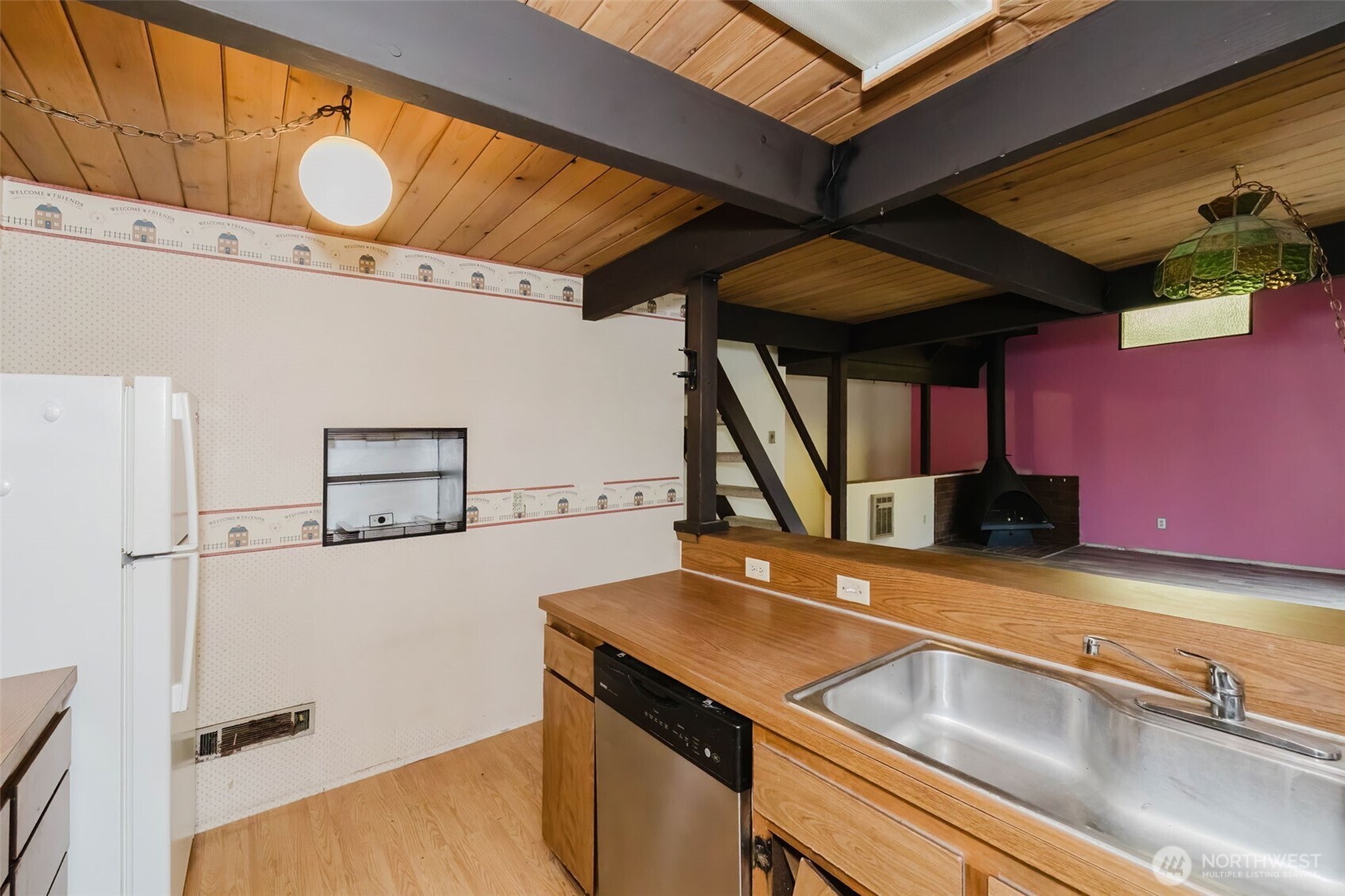 4311 67th Avenue West, Unit B Tacoma, WA 98466 - Photo 18 of 39 a kitchen with stainless steel appliances a sink a stove and a refrigerator