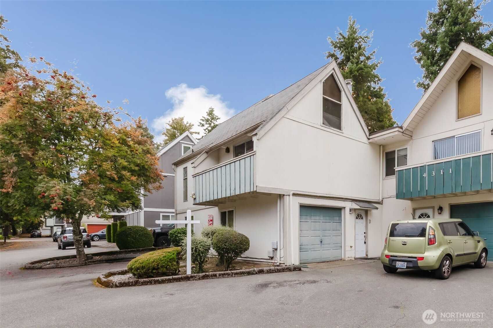 4311 67th Avenue West, Unit B Tacoma, WA 98466 - Photo 2 of 39 a car parked in front of a house