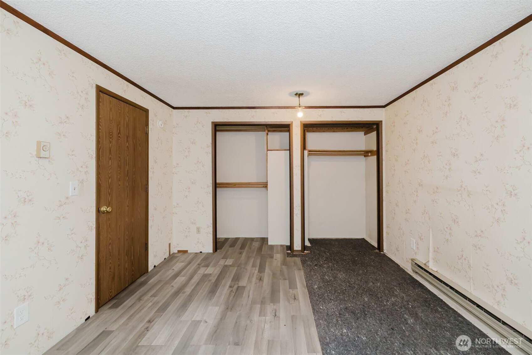 4311 67th Avenue West, Unit B Tacoma, WA 98466 - Photo 22 of 39 a view of an empty room with wooden floor