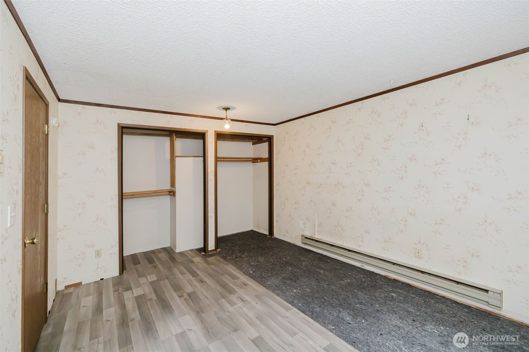 4311 67th Avenue West, Unit B Tacoma, WA 98466 - Photo 23 of 39 wooden floor in an empty room with a window