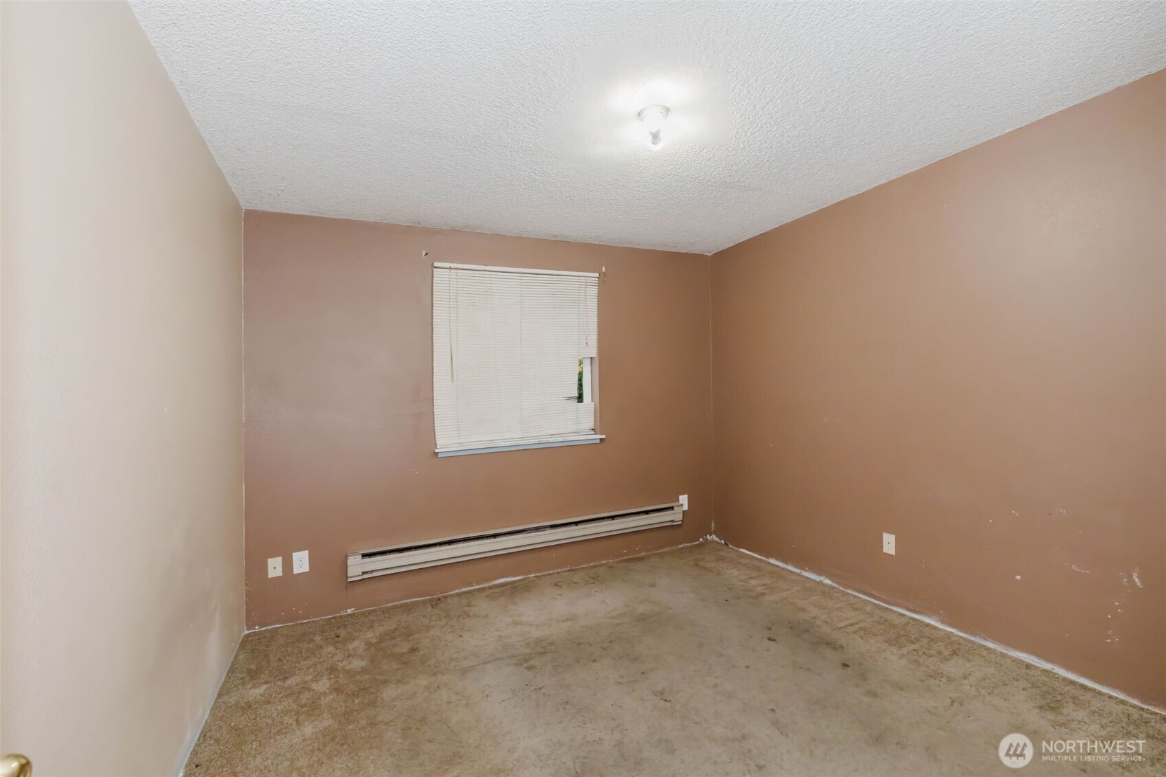 4311 67th Avenue West, Unit B Tacoma, WA 98466 - Photo 30 of 39 an empty room with a window