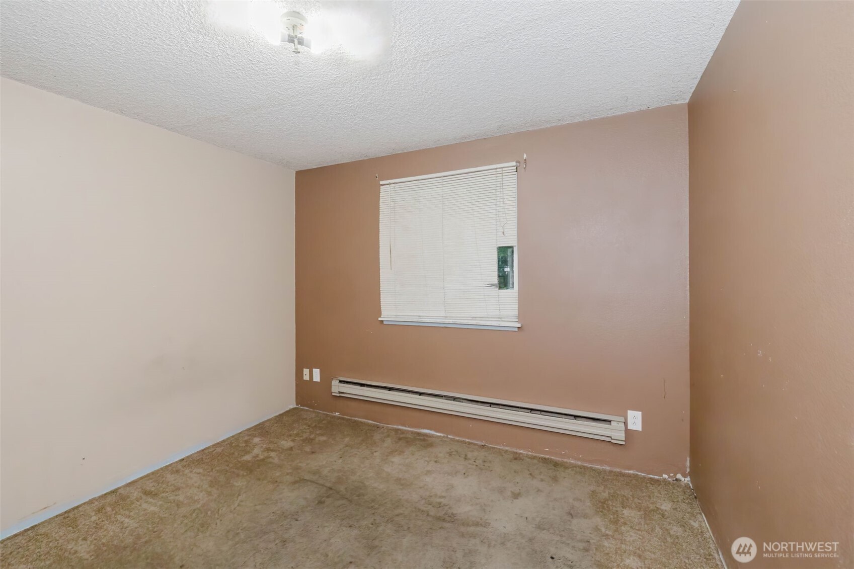 4311 67th Avenue West, Unit B Tacoma, WA 98466 - Photo 33 of 39 an empty room with a empty space and a window