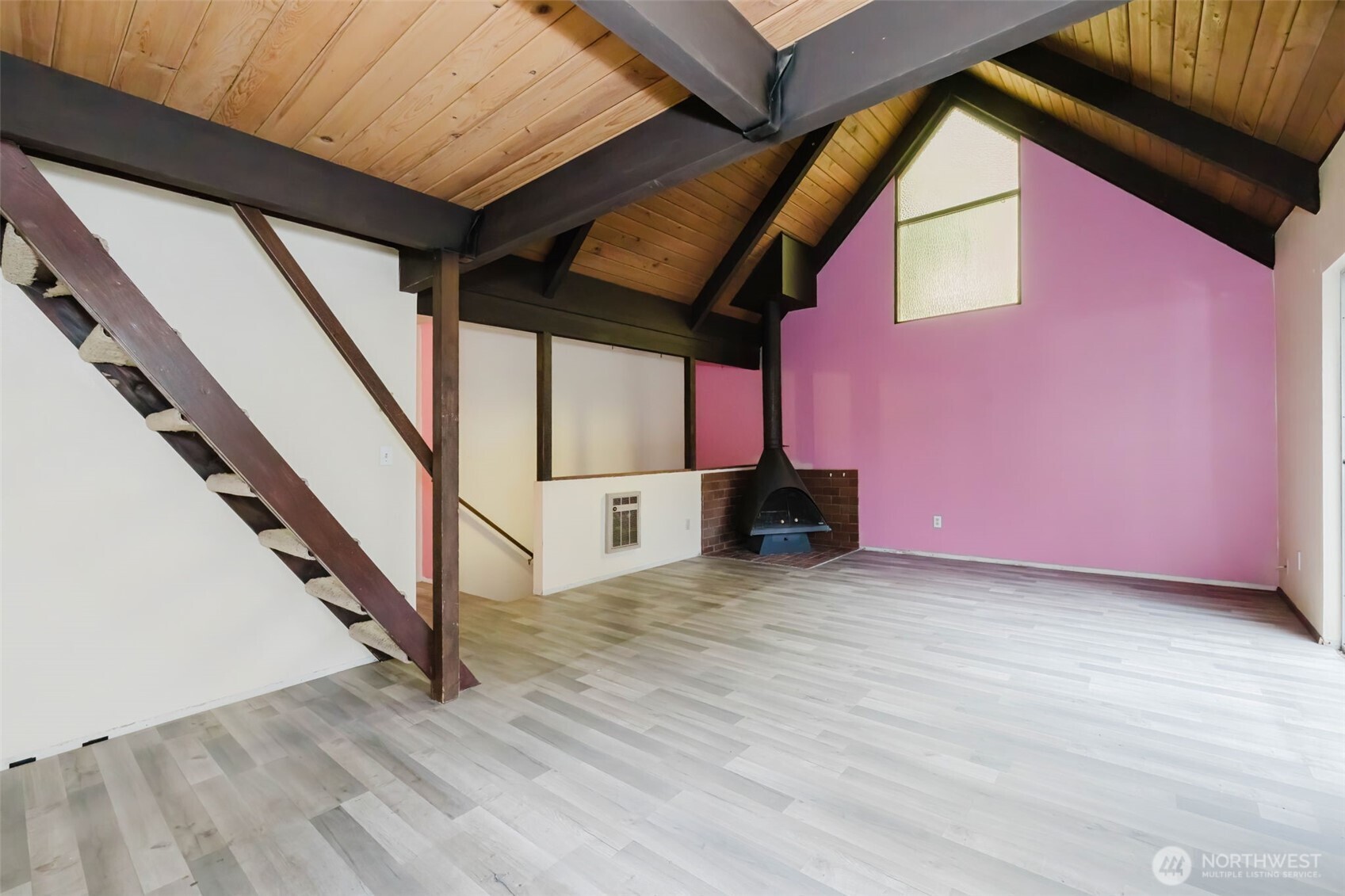4311 67th Avenue West, Unit B Tacoma, WA 98466 - Photo 6 of 39 a view of an empty room with wooden floor and stairs