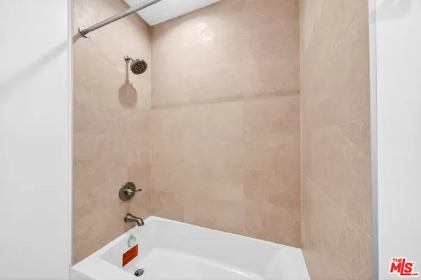 a bathroom with a sink vanity and a mirror