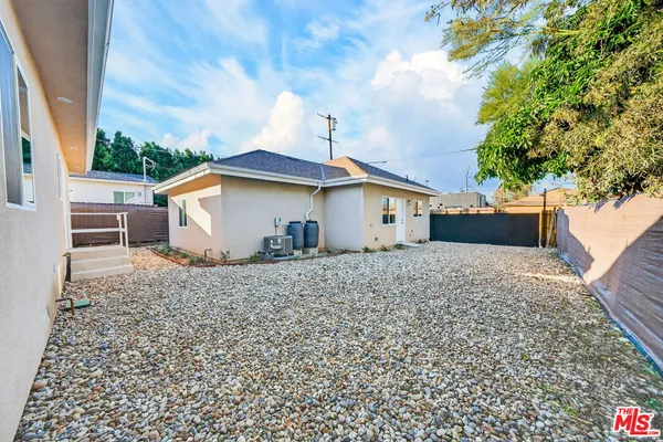 a backyard of a house with seating space