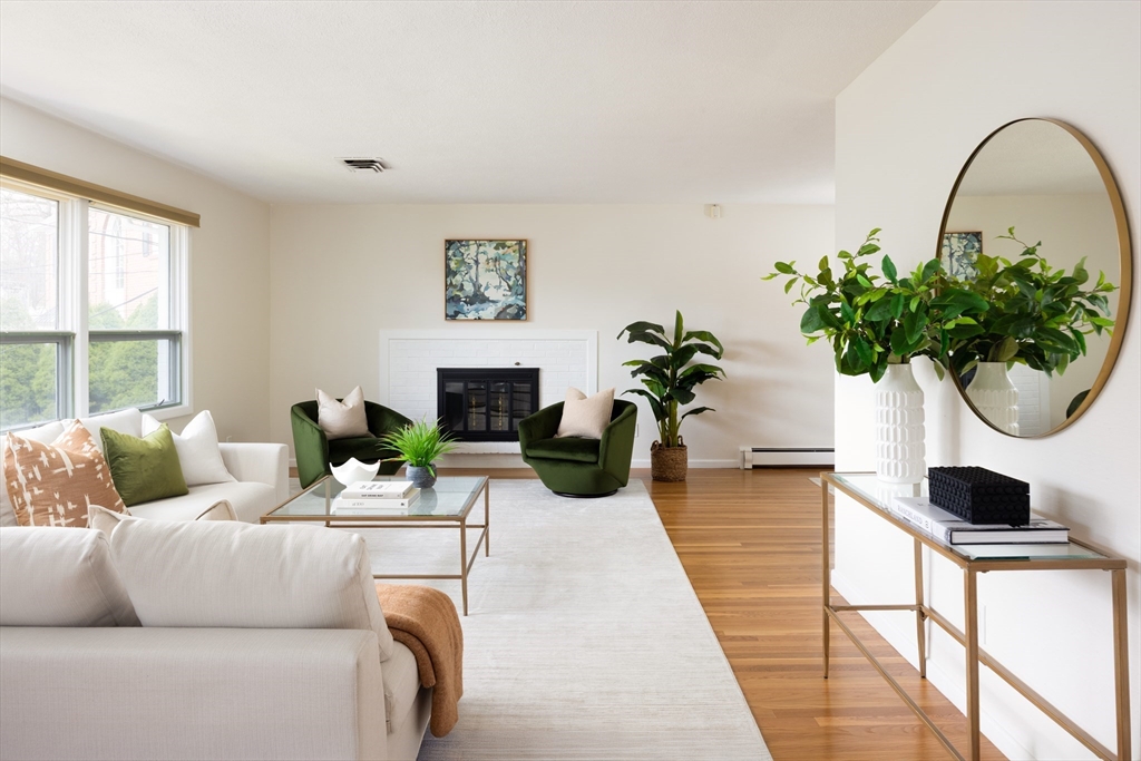 535 Clinton Road Brookline, MA 02467 - Photo 4 of 12 a living room with furniture a potted plant and a window