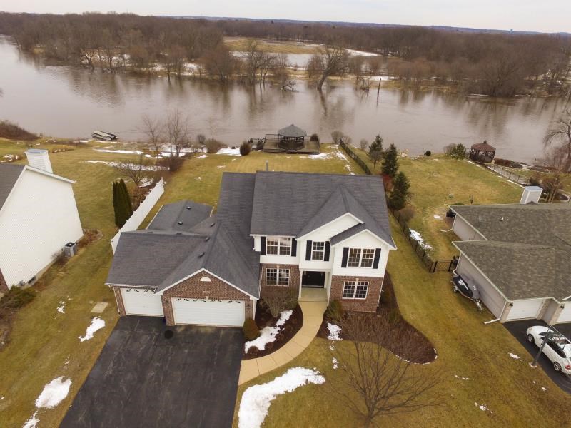 10815 Chicory Ridge Way Roscoe, IL 61073 - Photo 1 of 25 an aerial view of a house with lake view