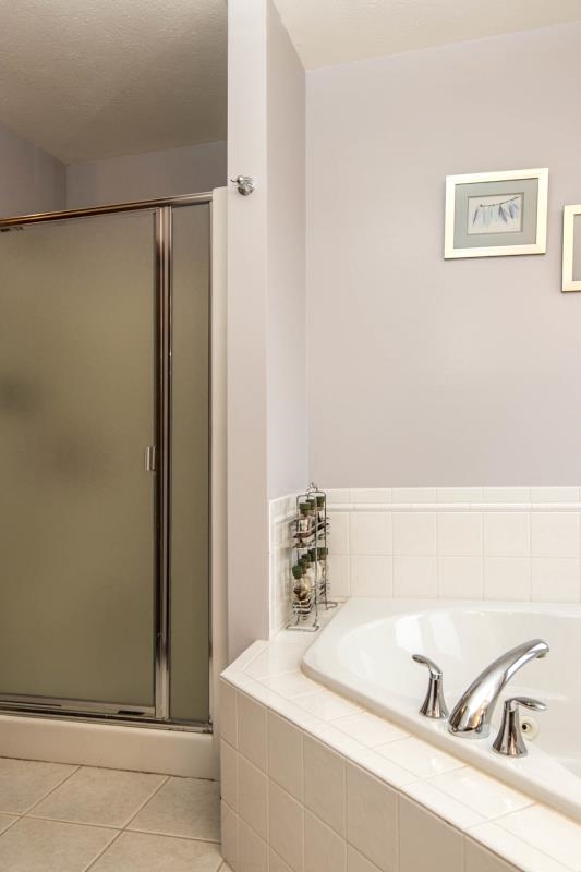 10815 Chicory Ridge Way Roscoe, IL 61073 - Photo 15 of 25 a bathroom with a tub and a sink