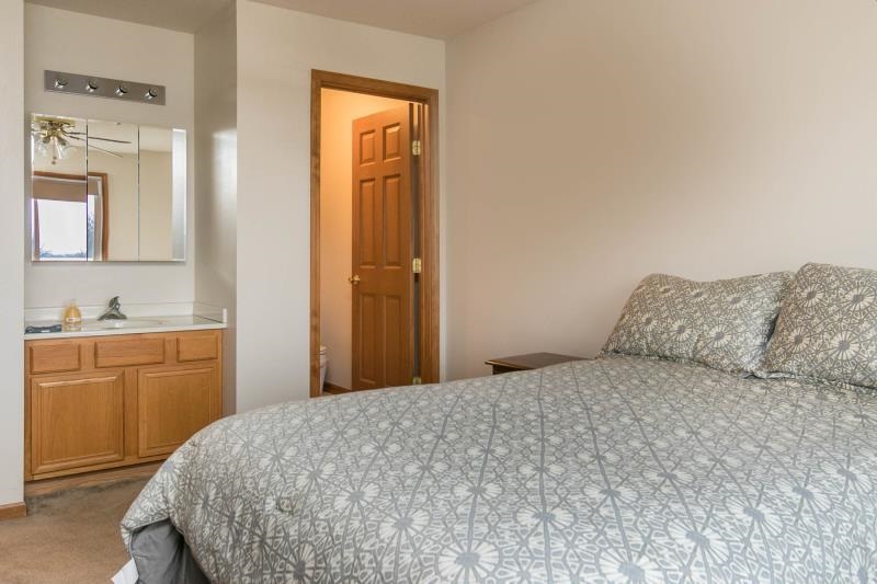 10815 Chicory Ridge Way Roscoe, IL 61073 - Photo 19 of 25 a bedroom with a bed and a dresser