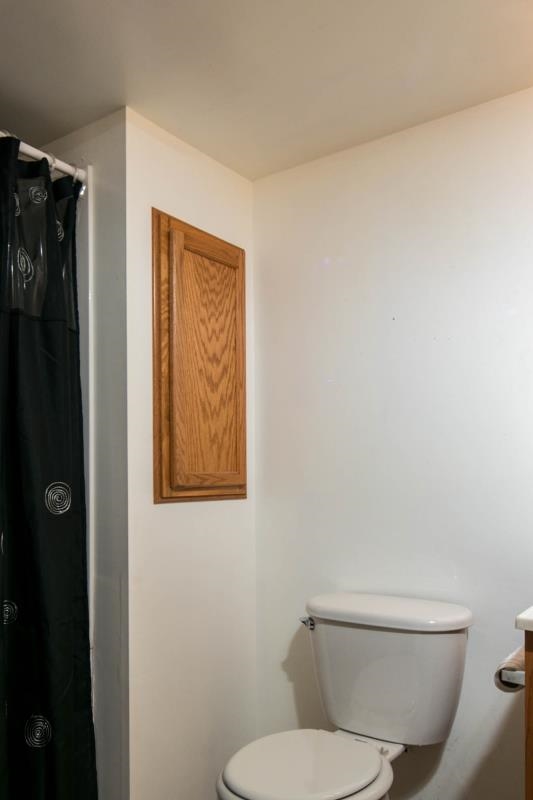 10815 Chicory Ridge Way Roscoe, IL 61073 - Photo 24 of 25 a white toilet sitting next to a bathroom sink