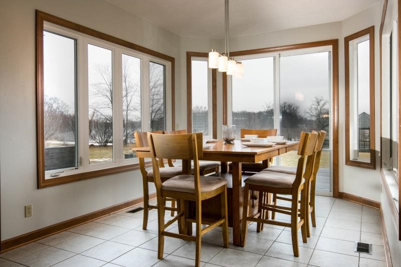 10815 Chicory Ridge Way Roscoe, IL 61073 - Photo 10 of 25 a dining room with furniture and a floor to ceiling window