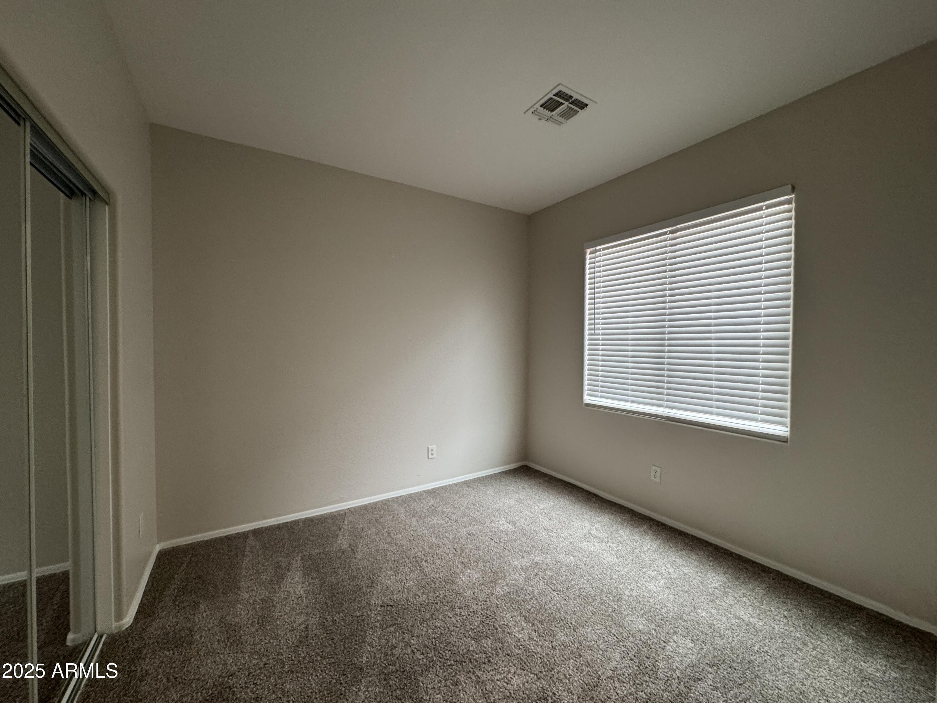 4554 East Sundance Avenue Gilbert, AZ 85297 - Photo 11 of 21 a view of an empty room with a window