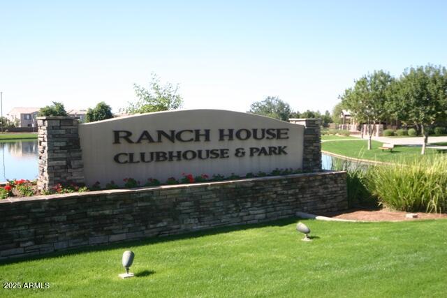4554 East Sundance Avenue Gilbert, AZ 85297 - Photo 17 of 21 a sign of golf club on a wall under a tree