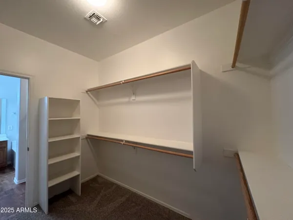 a view of an empty walk in closet