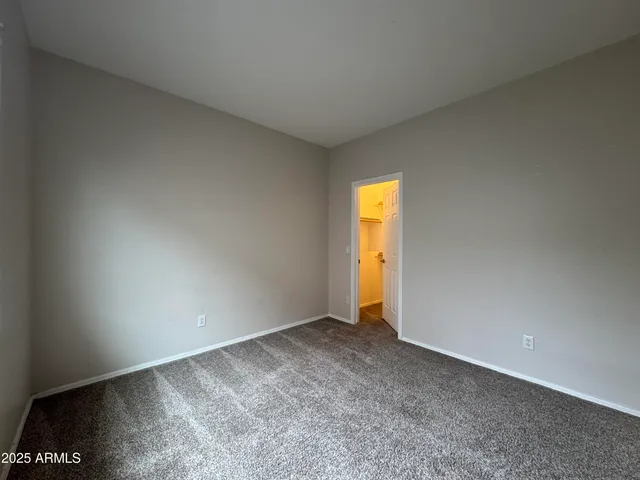 a view of an empty room and a window