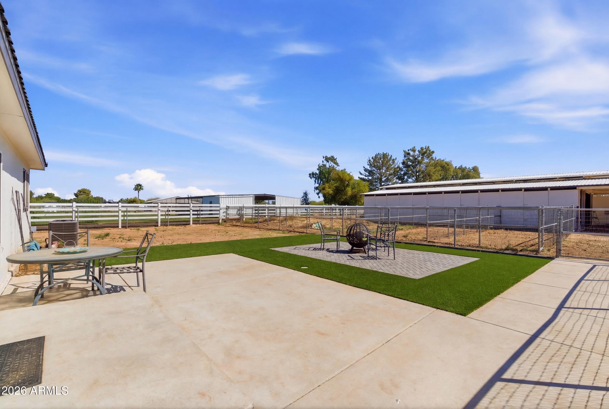 23317 South 180th Street Gilbert, AZ 85298 - Photo 14 of 36 a view of swimming pool with seating space and yard in back