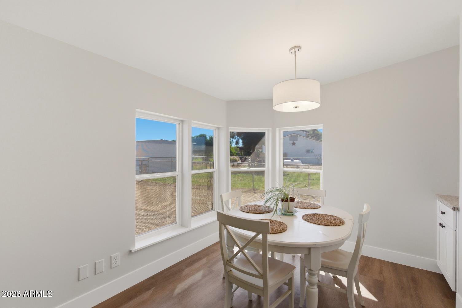 23317 South 180th Street Gilbert, AZ 85298 - Photo 21 of 36 a view of a dining room with furniture window and wooden floor
