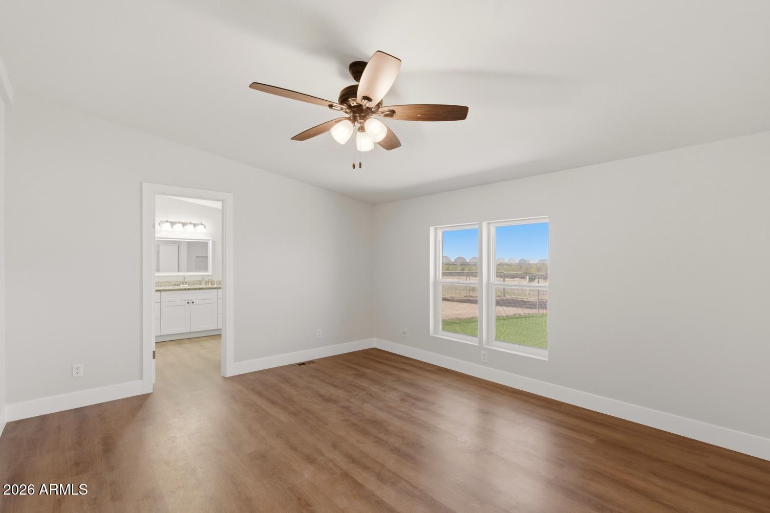 23317 South 180th Street Gilbert, AZ 85298 - Photo 28 of 36 wooden floor in an empty room with a window