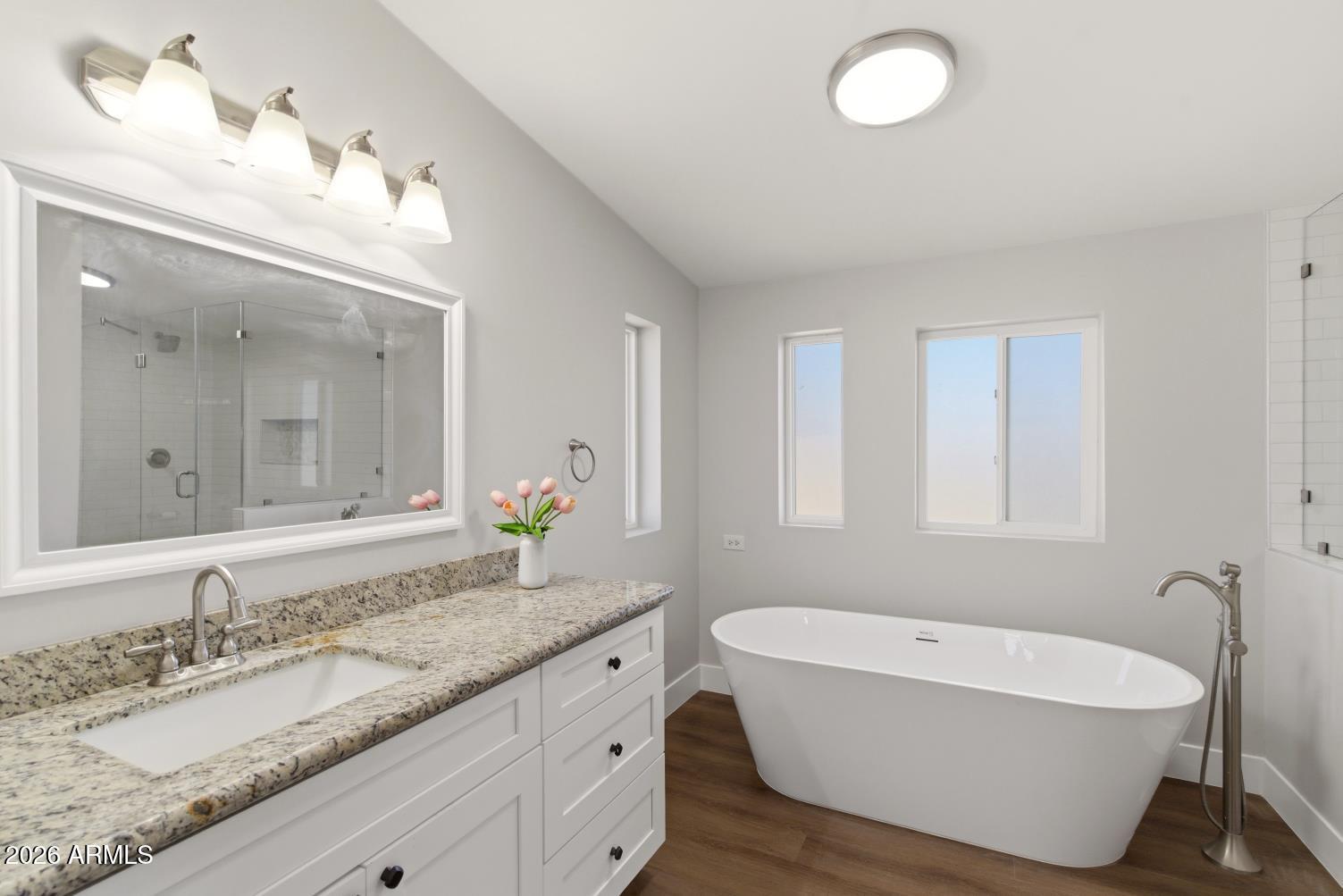 23317 South 180th Street Gilbert, AZ 85298 - Photo 29 of 36 a bathroom with a granite countertop bathtub sink double and mirror