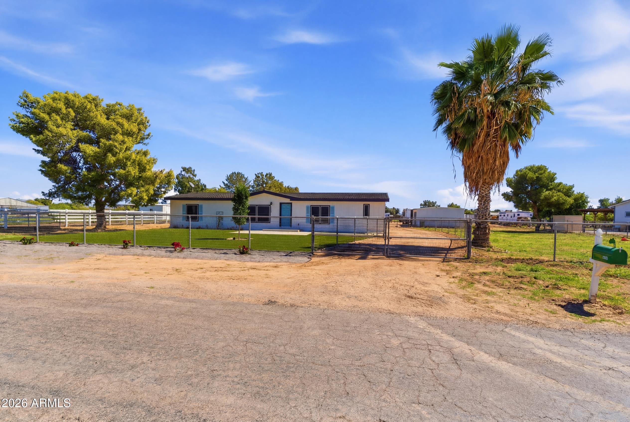 23317 South 180th Street Gilbert, AZ 85298 - Photo 35 of 36 a view of swimming pool with a yard and palm trees