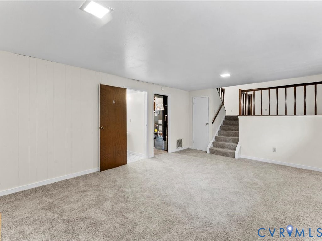 9611 Kennesaw Road Chesterfield, VA 23236 - Photo 14 of 20 Basement with stairs, light carpet, and heating un