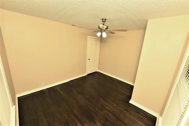 a view of a big room with wooden floor