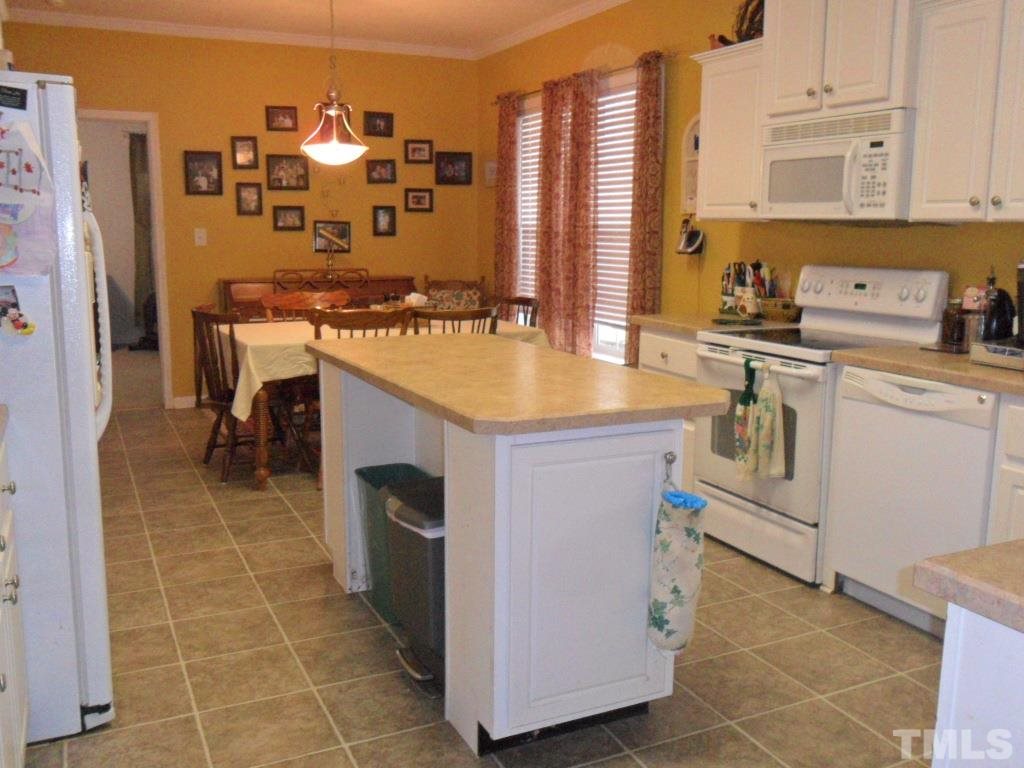 3997 Doyle Road Zebulon, NC 27597 - Photo 8 of 25 Large kitchen with built in hutch and buffet.