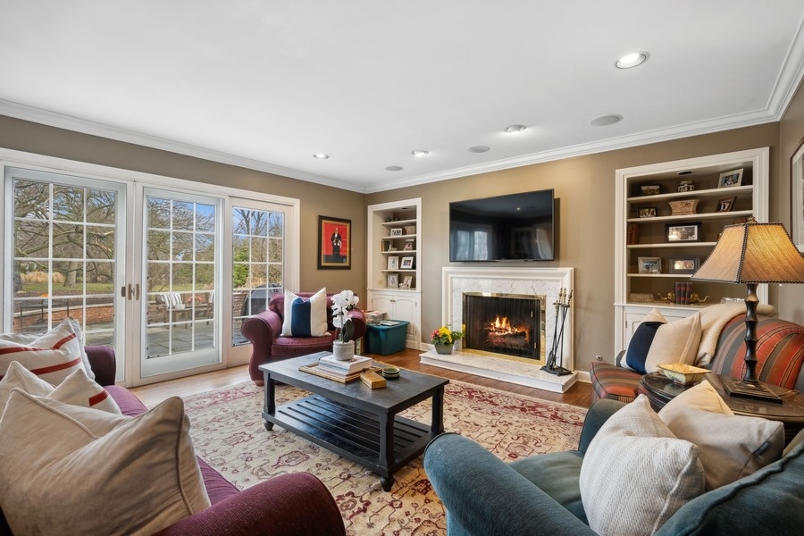 34 Longmeadow Road Winnetka, IL 60093 - Photo 16 of 35 a living room with furniture fireplace and flat screen tv