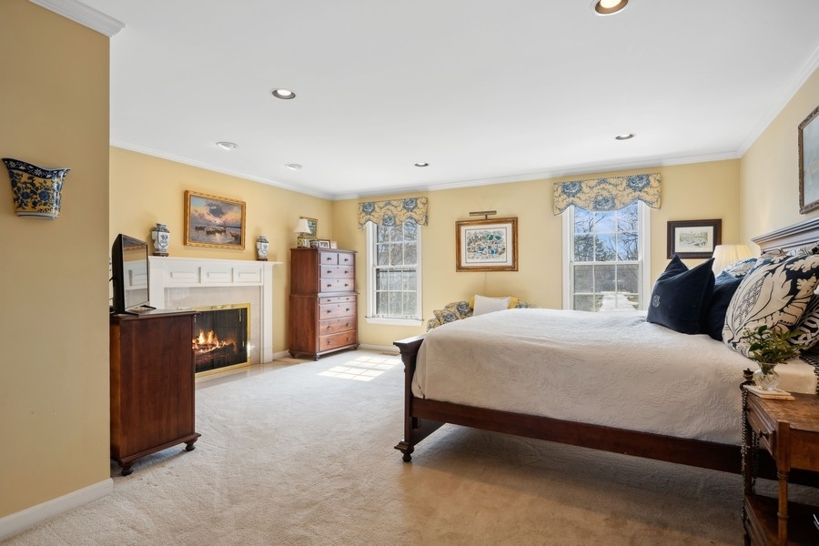 34 Longmeadow Road Winnetka, IL 60093 - Photo 19 of 35 a bedroom with a bed and a couch