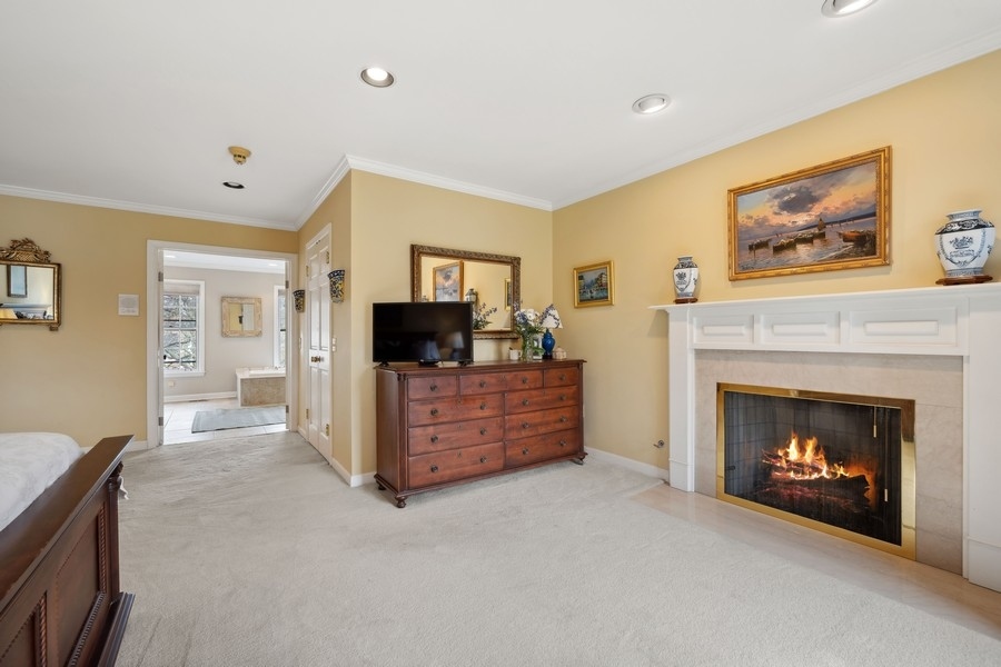 34 Longmeadow Road Winnetka, IL 60093 - Photo 20 of 35 a living room with furniture and a fireplace