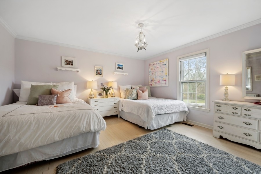 34 Longmeadow Road Winnetka, IL 60093 - Photo 22 of 35 a spacious bedroom with a bed and window
