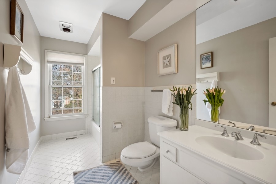 34 Longmeadow Road Winnetka, IL 60093 - Photo 27 of 35 a bathroom with a sink toilet and shower