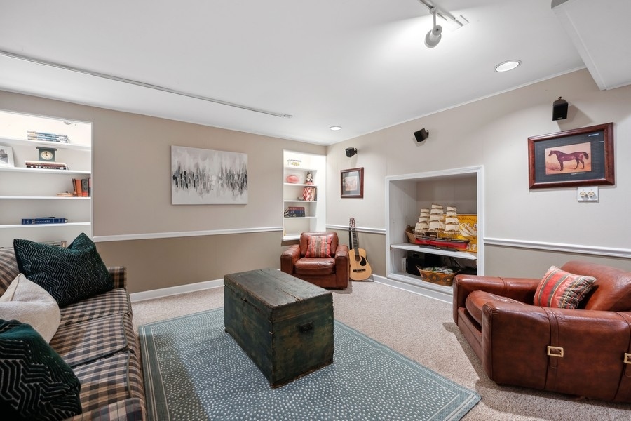 34 Longmeadow Road Winnetka, IL 60093 - Photo 30 of 35 a living room with furniture and a flat screen tv