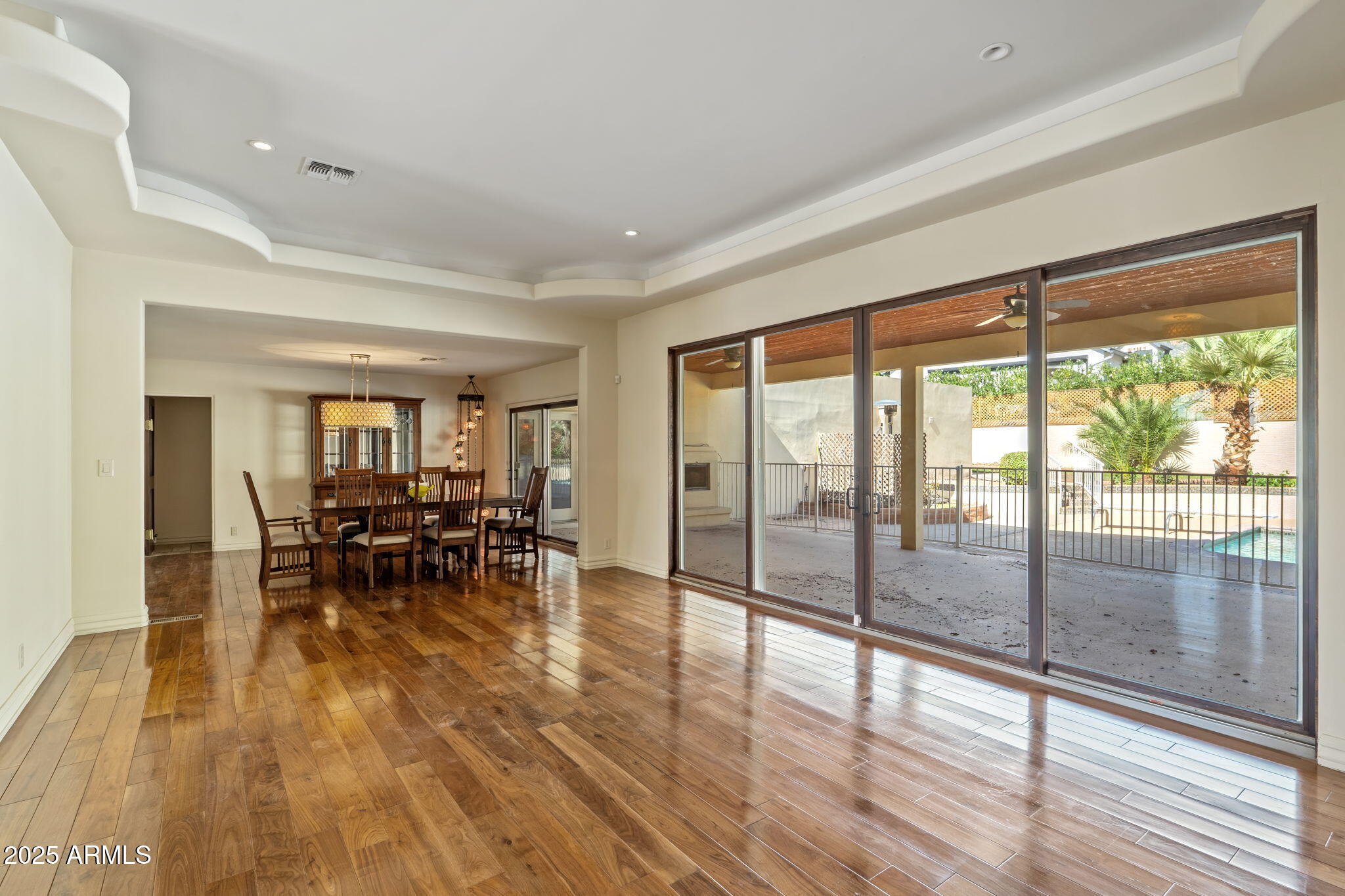 5310 East Camelback Road Phoenix, AZ 85018 - Photo 11 of 50 a view of dining room with furniture and wooden floor