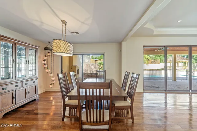 a view of a dining room with furniture window and wooden floor