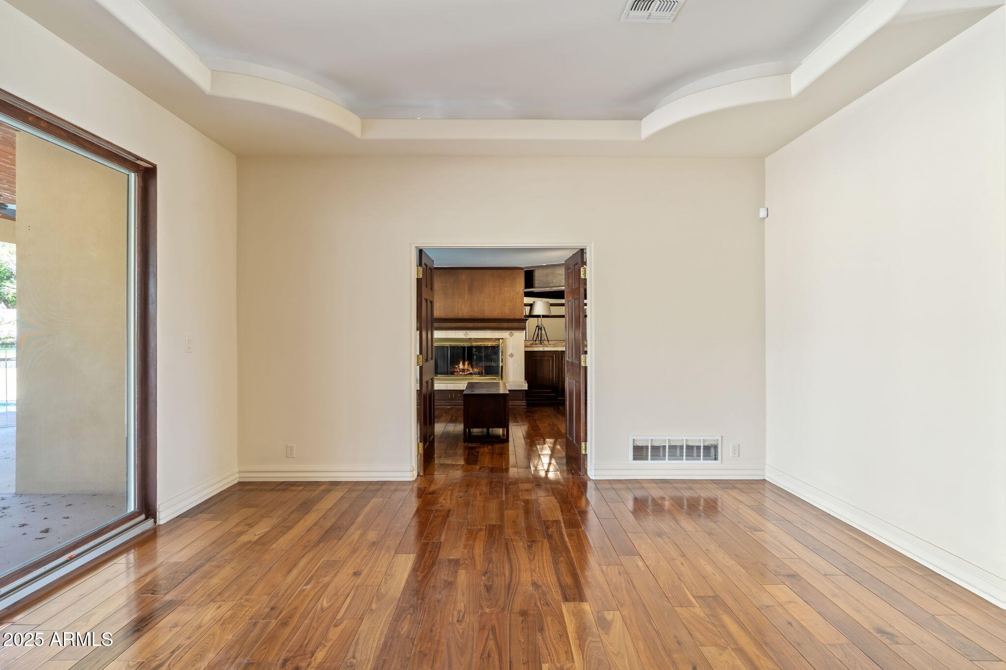 5310 East Camelback Road Phoenix, AZ 85018 - Photo 13 of 50 a view of a room with wooden floor and a window