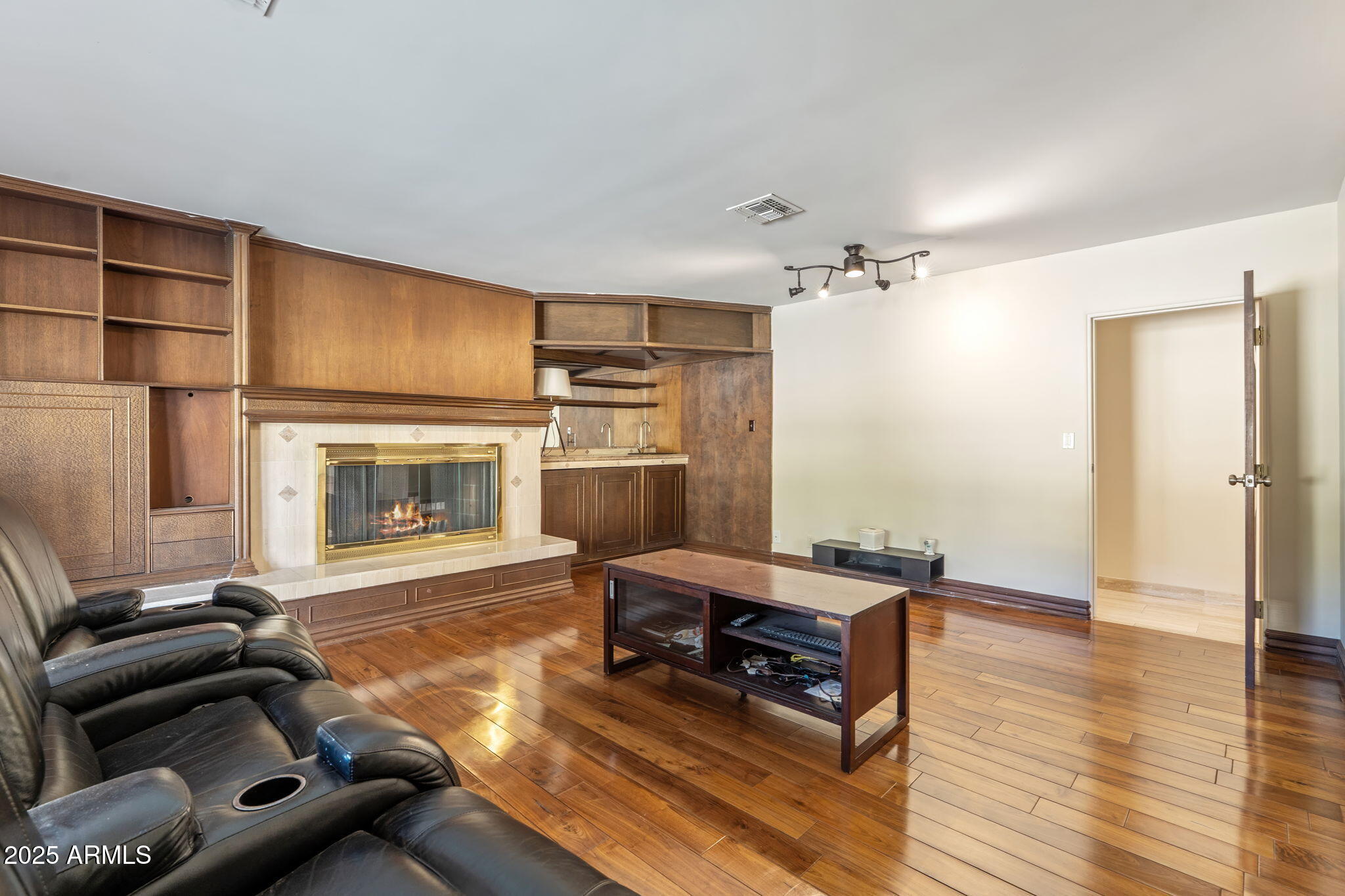 5310 East Camelback Road Phoenix, AZ 85018 - Photo 19 of 50 a room with furniture and a fireplace