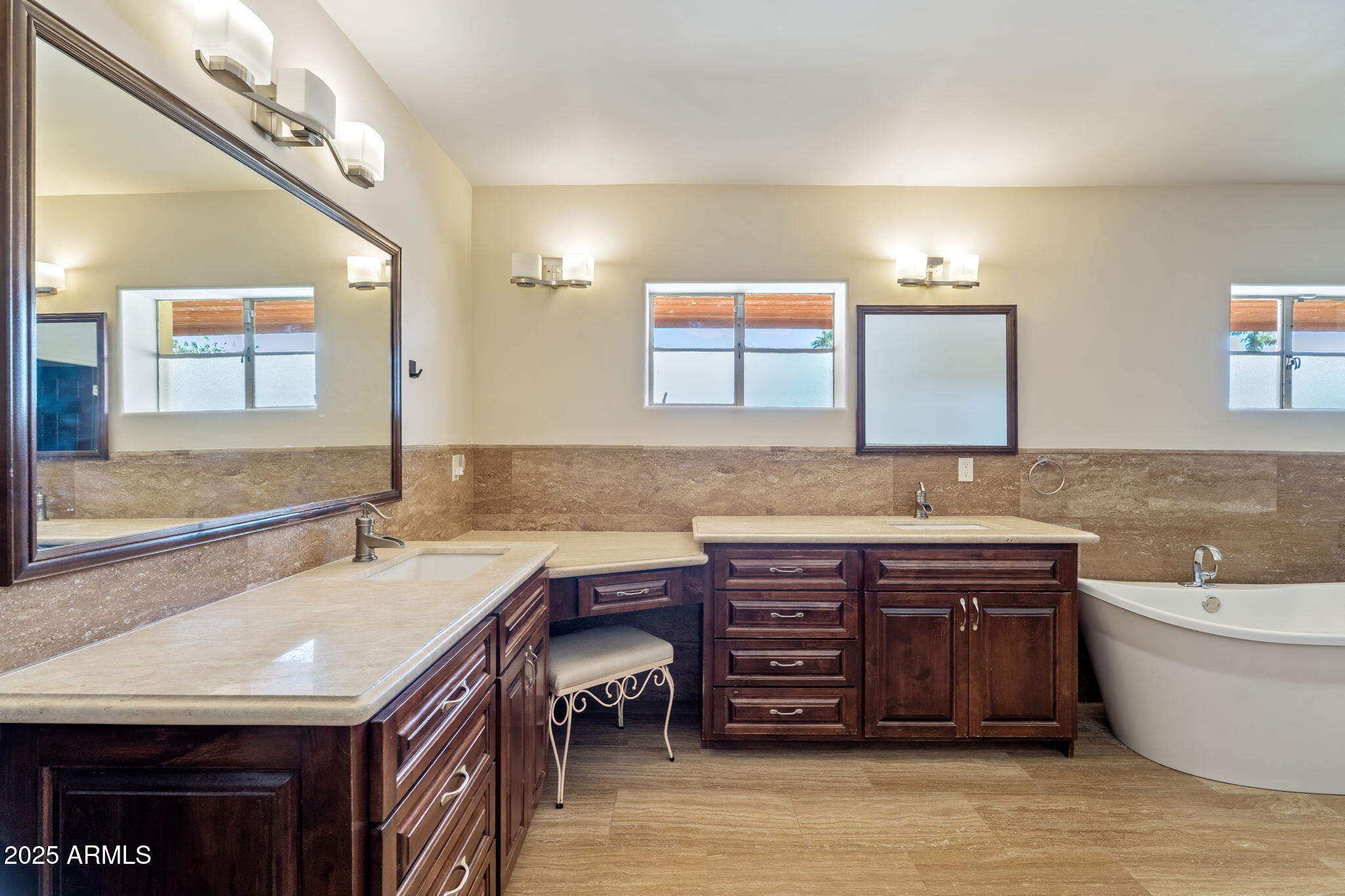 5310 East Camelback Road Phoenix, AZ 85018 - Photo 26 of 50 a bathroom with a granite countertop sink a large mirror and a bathtub