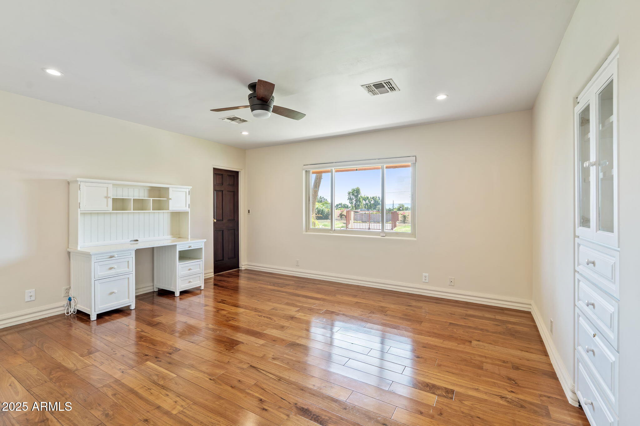 5310 East Camelback Road Phoenix, AZ 85018 - Photo 28 of 50 wooden floor in an empty room with a window