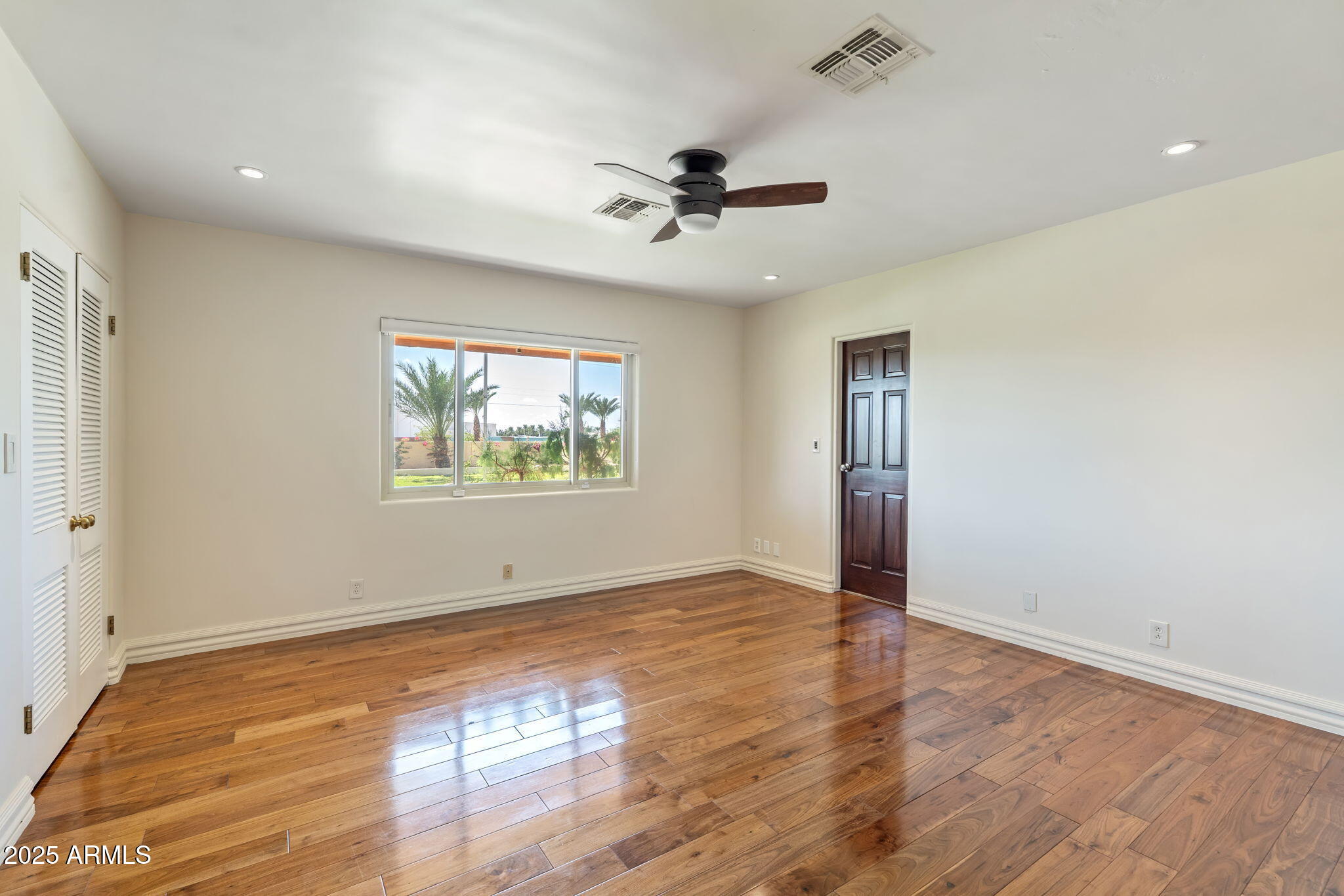 5310 East Camelback Road Phoenix, AZ 85018 - Photo 31 of 50 wooden floor in an empty room with a window