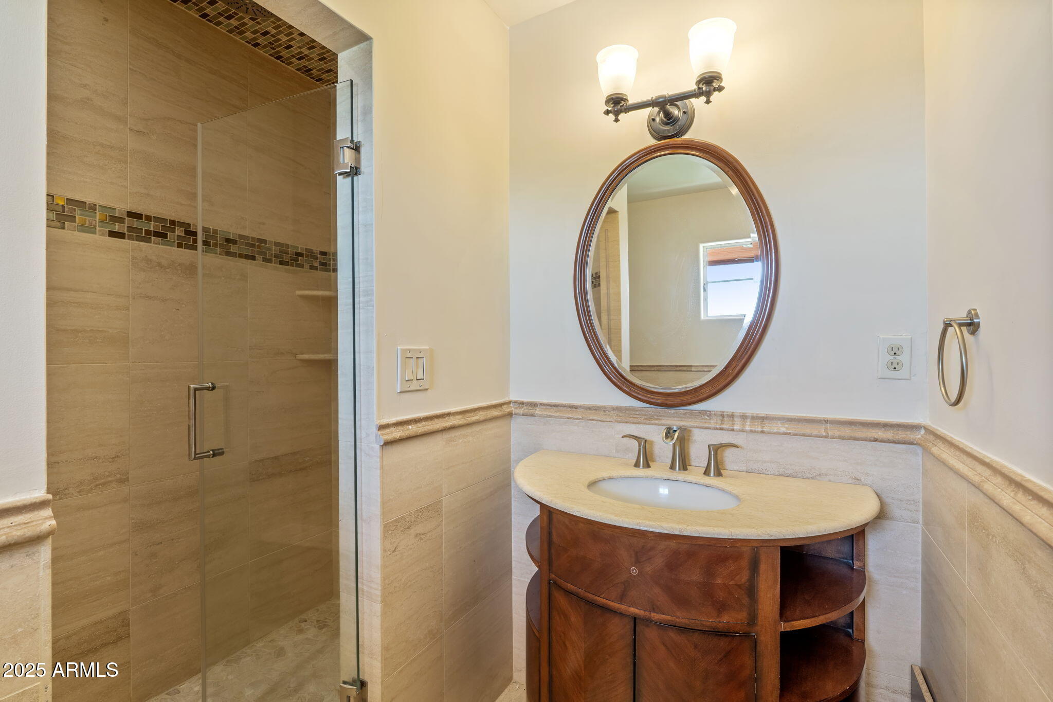 5310 East Camelback Road Phoenix, AZ 85018 - Photo 32 of 50 a bathroom with a sink a mirror and a shower