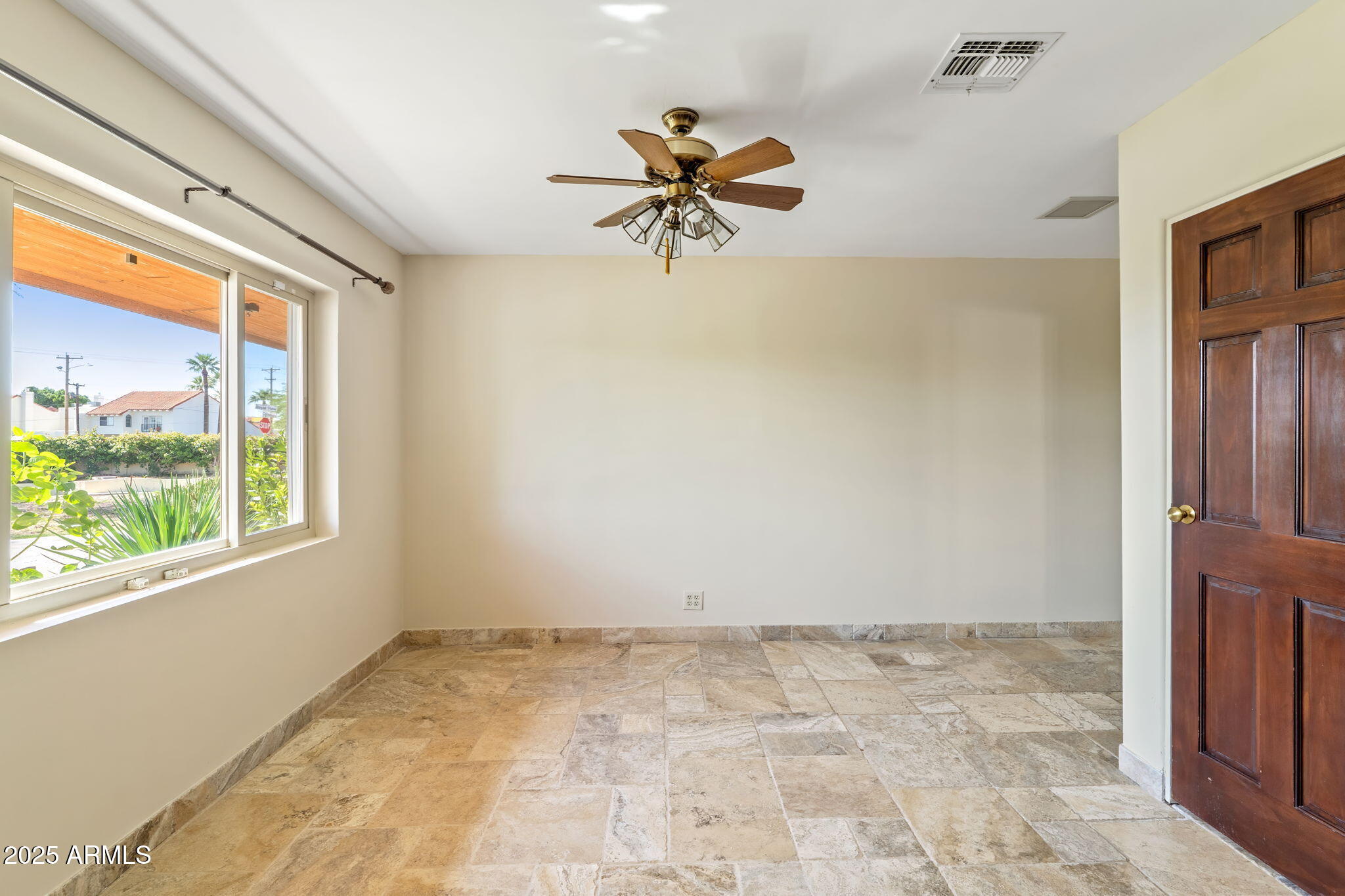 5310 East Camelback Road Phoenix, AZ 85018 - Photo 34 of 50 a view of a livingroom with a ceiling fan and window
