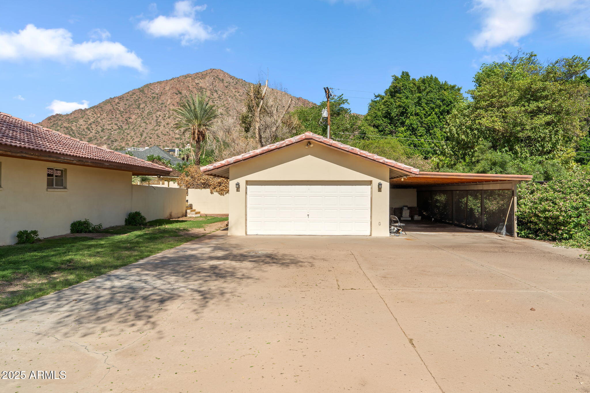 5310 East Camelback Road Phoenix, AZ 85018 - Photo 44 of 50 a front view of a house with a yard and garage