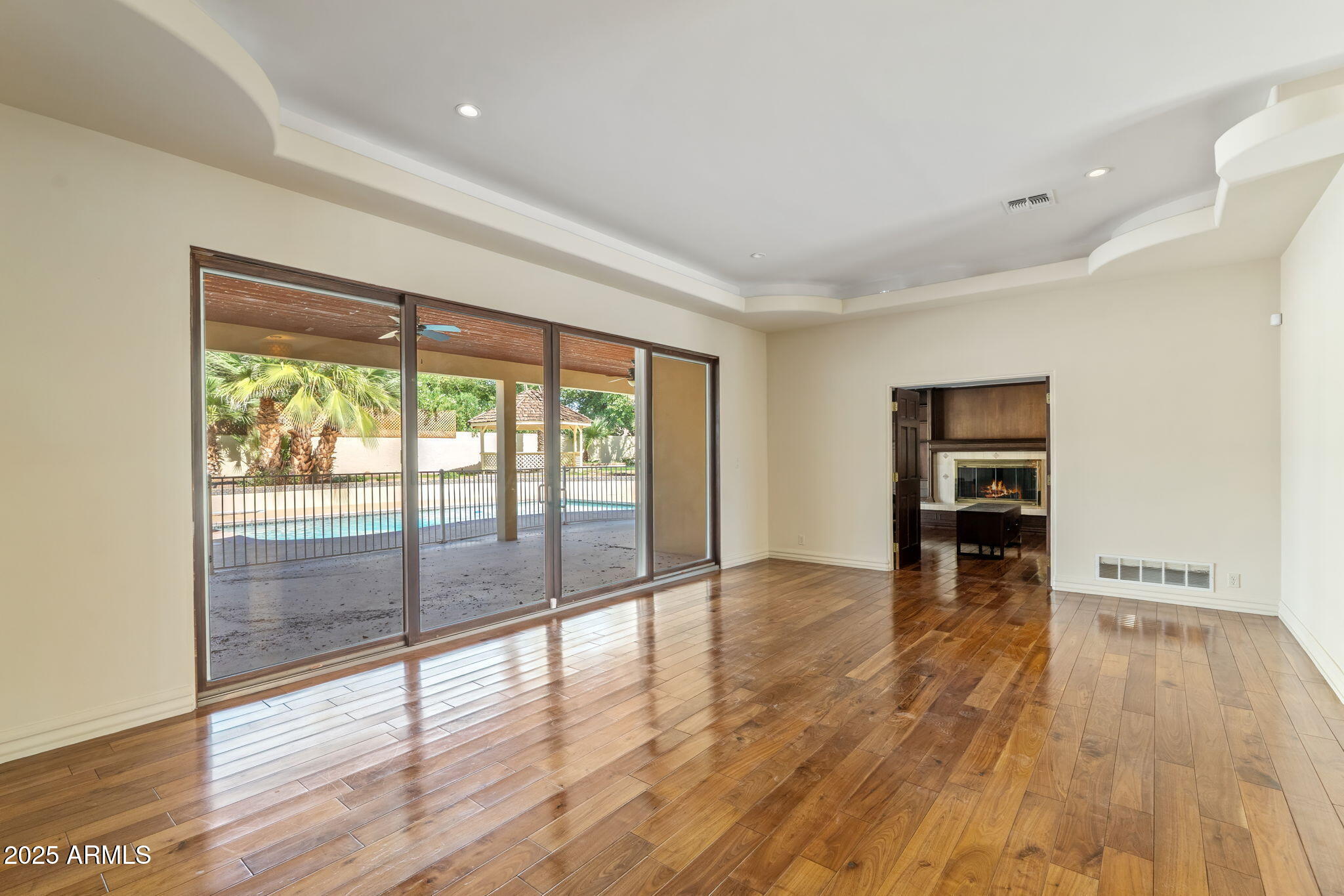 5310 East Camelback Road Phoenix, AZ 85018 - Photo 9 of 50 wooden floor in an empty room with a window