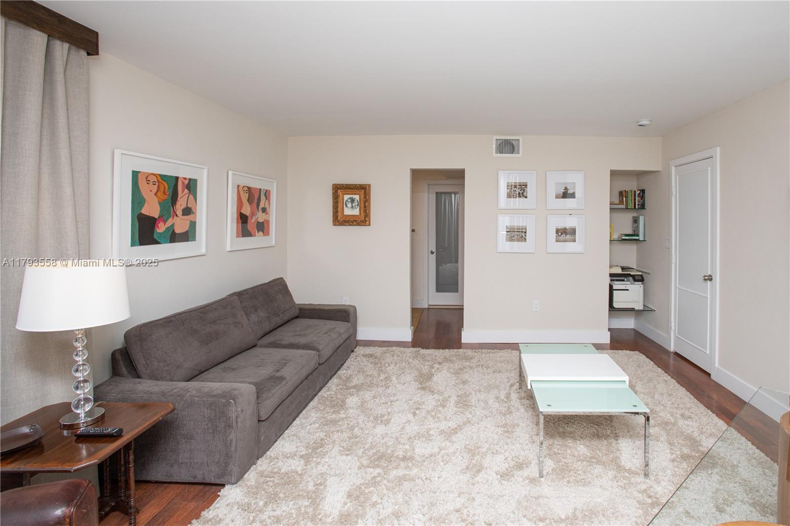 258 Seaview Drive, Unit 3 Key Biscayne, FL 33149 - Photo 11 of 14 a living room with furniture and painting on the wall