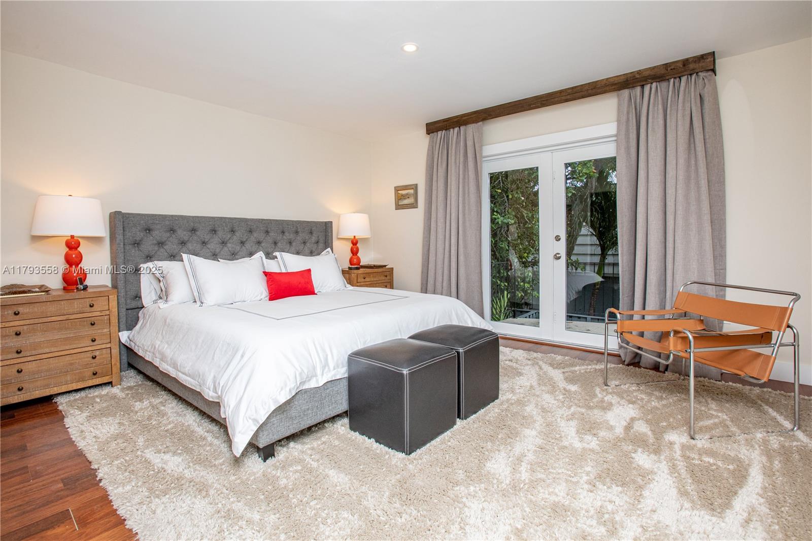 258 Seaview Drive, Unit 3 Key Biscayne, FL 33149 - Photo 9 of 14 a bed sitting in a bedroom next to a window