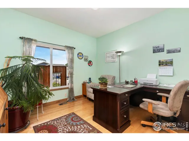a workspace with furniture and a potted plant